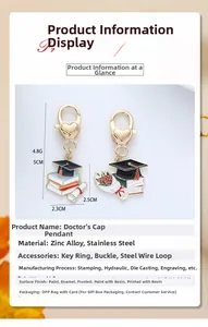 Detail view of graduation cap pendants made of zinc alloy with lobster heart clasps