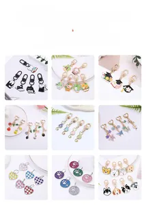 Collection of custom enamel keychains featuring cats, flowers, and colorful butterflies