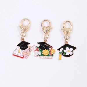 Three Graduation Season metal keychains with heart hooks, graduation cap and diplomas