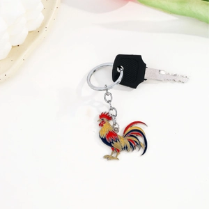 Creative rooster metal keychain with colorful enamel pendant on white background