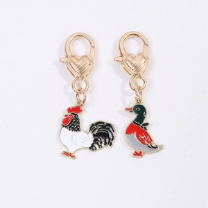 Pair of retro metal rooster and mallard duck enamel keychains with golden lobster clasps