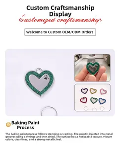 Detail view of heart-shaped glitter dog tags with paw prints and vibrant enamel finish
