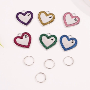 Set of 6 colorful heart-shaped pet ID tags with glitter edges and paw print accents
