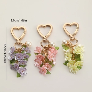 Detailed view of colorful floral keychains with heart hooks and pearls, sized 2.7x8.5cm