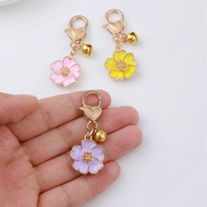 Floral cherry blossom alloy keychains with heart clasp and small gold bell charms set
