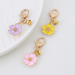 Sweet cherry blossom flower bag charms with gold bells and heart lobster clasps