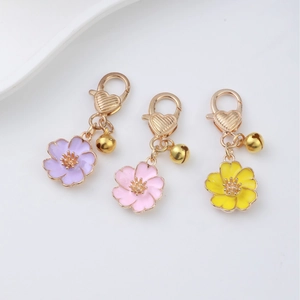 Enamel cherry blossom charm with heart lobster clasp and bell in purple and pink