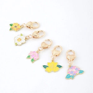 Set of 5 colorful floral enamel charms with heart-embossed gold lobster clasps