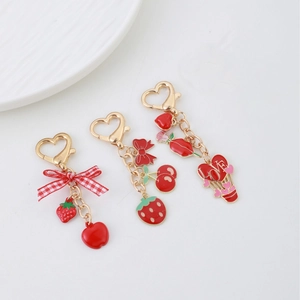 Lot de porte-clés fruits avec breloque fraise et nœud sur fermoir cœur doré