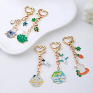 Cute space rabbit metal keychains with astronaut charms and heart lobster clasp hooks