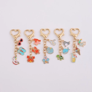 Golden heart-shaped metal keychains with colorful sea animal and summer enamel pendants