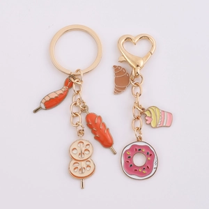 Creative metal keychains with enamel food charms like BBQ skewers and sweet desserts