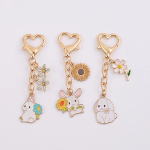 Cute cartoon rabbit and flower metal keychain set with colorful enamel pendants