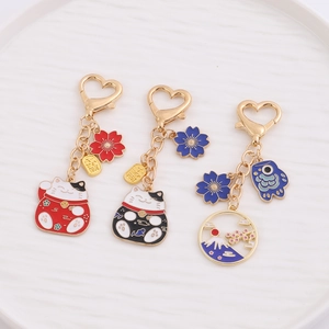 Japanese lucky cat and Fuji cherry blossom metal enamel keychains in gift gold finish