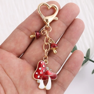 Cute red and white mushroom keychain with heart lobster clasp and sparkling rhinestones