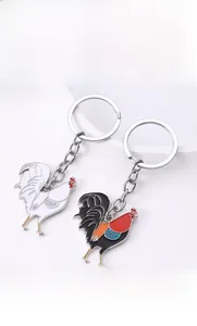 Detailed view of colorful enamel rooster keychain with polished metal finish and sturdy ring