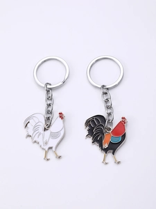 Detailed view of rooster enamel keychains in white and colorful zinc alloy finishes