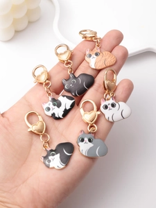 Detailed set of six colorful enamel cat charms with heart-shaped golden lobster clasps