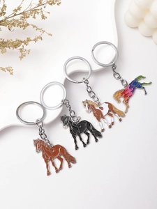 Detail view of colorful horse enamel keychains with metallic finish and artistic decor