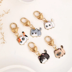 Set of five cute cartoon cat zinc alloy keychains with golden heart-shaped lobster clasps