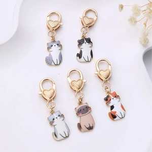 Set of five cute cartoon cat charms with heart lobster clasps for bags and keyrings