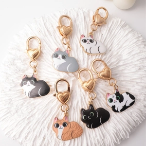 Set of six cute cartoon cat zinc alloy keychains with golden heart-shaped swivel clasps