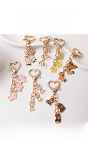Detailed collection of cute enamel animal keychains with gold heart-shaped lobster clasps