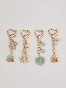 Set of 4 colorful floral keychains with gold heart clasps in purple white blue and pink