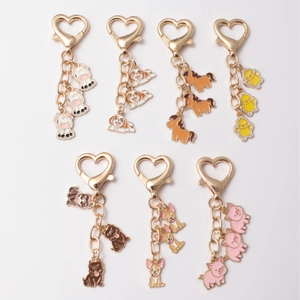 Cartoon animal enamel keychains featuring cute cow, chick, and pig with heart clasps