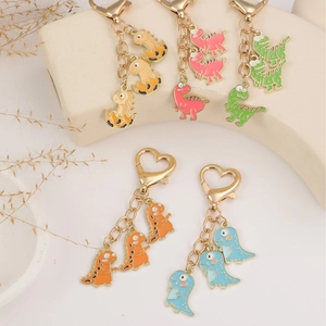 Set of 5 colorful cartoon dinosaur metal keychains with heart-shaped lobster clasps