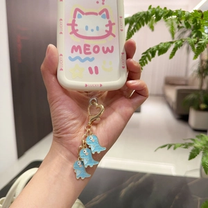 Cute white cartoon card holder with blue dinosaur charms and golden heart lobster clasp