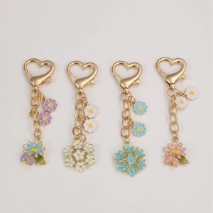 Colorful floral heart keychain set with bees and enamel flower charms for backpacks