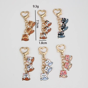 Cute cartoon cat and fish keychain set with golden heart clasps in six vibrant colors