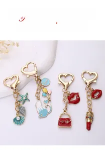 Détails de porte-clés en métal doré avec crochets en cœur, étoile de mer et chats