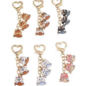 Set of 6 cute cartoon cat keychains with heart hooks holding fish snacks