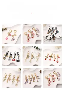 Detailed grid showing creative enamel tulip and floral metal keychains with gold heart clasps