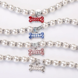 Elegant pearl pet collar necklace with rhinestone bone charms in multiple colors
