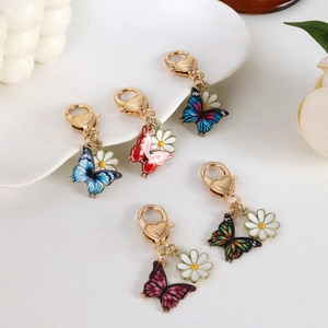Colorful butterfly and daisy charms with golden heart lobster clasps for keychains