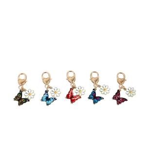 Set of 5 colorful butterfly and daisy heart clasp keychains in various vibrant finishes