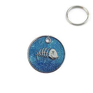 Blue glitter round pet ID tag with metal fishbone detail and silver keyring attachment