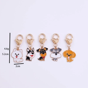 Set of five cartoon dog alloy charms with gold heart clasps for bags and DIY crafts