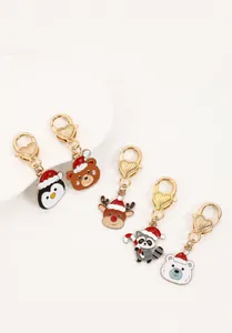 Détails des porte-clés de Noël animaux avec pingouin et ours et attaches dorées