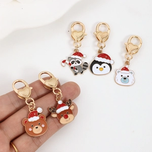 Porte-clés animaux de Noël mignons avec ours et manchot et fermoirs coeur dorés