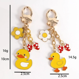Cute yellow duck metal keychain with flower clip and polka dot bow accessory charm