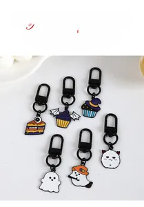Macro detail of Halloween cartoon ghost pendants and colorful alloy enamel keychains