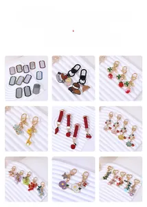 Detail of custom enamel cherry and fruit keychains with sparkling crystal rhinestones