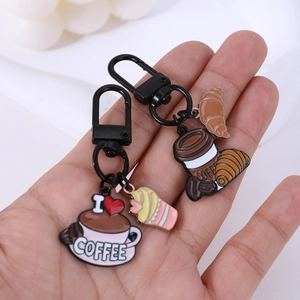 Coffee themed enamel keychains with cute cup and croissant charms on black metal hooks