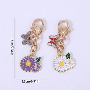 Lot de porte-clés marguerite et papillon en émail violet et blanc avec métal doré