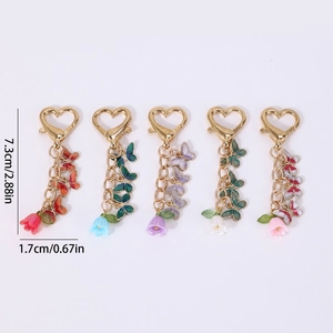 Set of 5 colorful enamel butterfly and flower keychains with golden heart lobster clasps