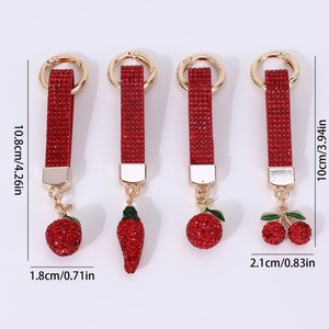 Red rhinestone fruit keychains featuring cherry strawberry and apple in gold metal finish